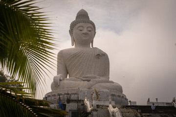 Big buddha statue, Phuket, Thailand - 05.05.2021: Big Buddha monument on the island of Phuket in Thailand.Reinforced concrete structure adorned with white jade marble Suryakanta from Myanmar