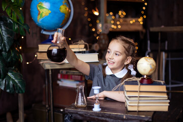 natural science chemistry lesson. Back to school. The student learns. The schoolgirl laughs. Pupil...