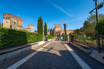 Medieval Scaligero Castle and Fortified Walls (IX-XIV century), of the small Lazise village, tourist resort on the coast of Lake Garda (Lago di Garda). Verona province, Veneto, Italy, southern Europe.