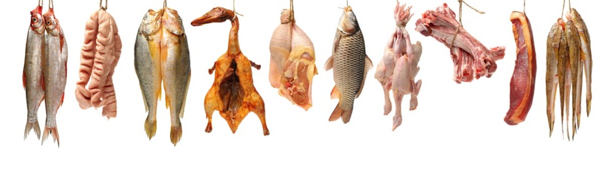 Raw fish carp,spare ribs and raw hen on white background 