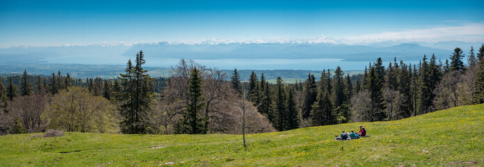 panoramic view from Jura Vaudoise over Lake Geneva to the Alps with Mont Blanc