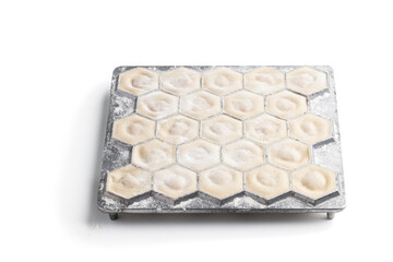 Pelmeni - dumplings of Russian cuisine with minced meat filling wrapped in thin unleavened dough isolated on white. A series of photos...