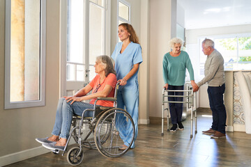 Nurse and senior citizens with disabilities in old people's home