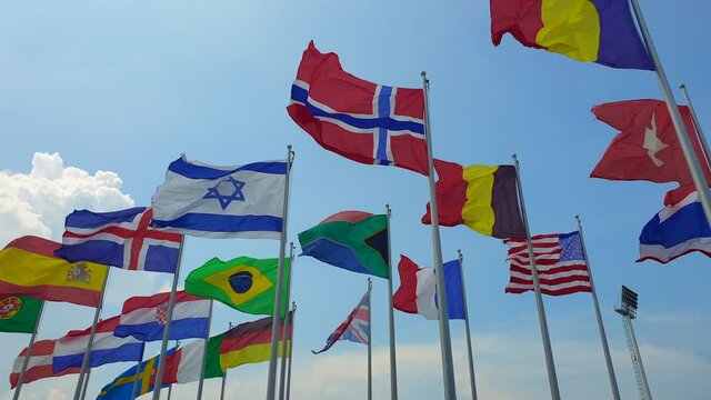 International colorful multi flags sway in outdoor wind abstract of world collaboration fight no war and peace