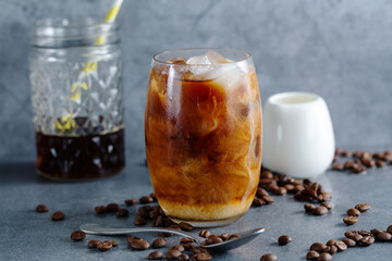 Iced coffee with ice cubes in glass
