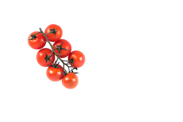 a branch of red Cherry-tomatoes isolated on white background flat lay