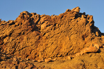 Strong texture of coastal rocks in the afternoon sun