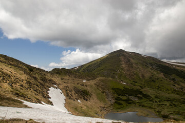 mountains in summer in the clouds