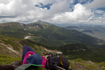 woman looks lying on a mountain range