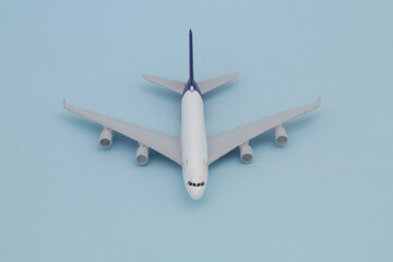 Airplane model on blue background., front view