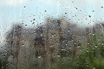 Window glass with raindrops as background, closeup