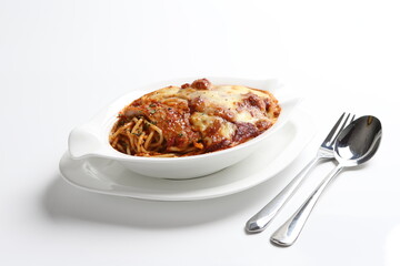 oven baked creamy cheese tomato Bolognese pasta with grilled chicken chop in bowl western chef cuisine seafood menu in white and brown background