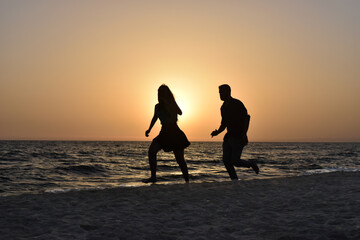 Fototapeta premium Running on the Beach at Sunset