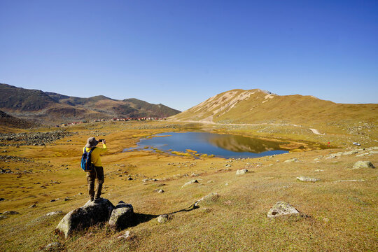 person walking in the mountains