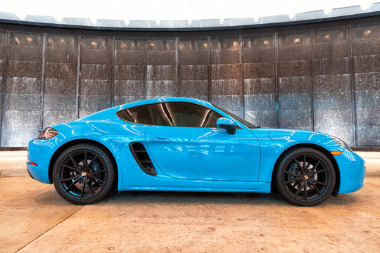 Palm Beach, Florida USA - March 22, 2021: Blue Porsche 718 Cayman. Right Side View.