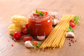 raw pasta,  tomato sauce and parsley