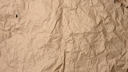 crumpled blank sheet of brown wrapping kraft paper, vintage texture for the designer