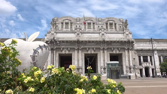 The square with flowers of the central railway station of the city of Milan in Italy.