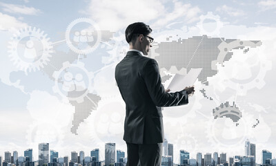 Concept of business success and control with confident boss against cityscape background