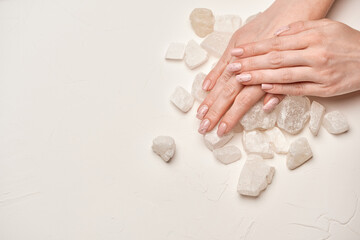 Woman hands with beautiful manicure on light background