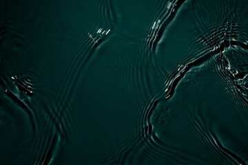 Black transparent clear calm water surface texture with ripples, splashes Abstract nature...