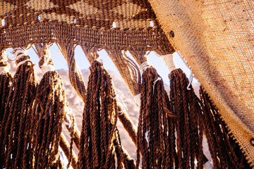 Traditional jute decoration at the entrance, closeup. In the desert near Dahab, Sinai, Egypt. Sackcloth or burlap tent.