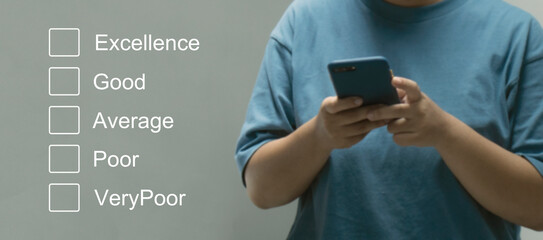 Customer service evaluation concept.Businesswomen hand putting check mark a checkbox on smarthphone for a satisfaction survey.