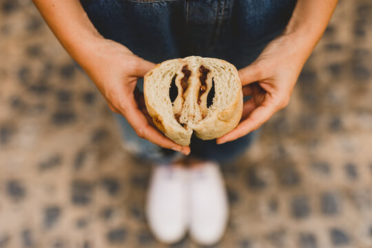 Hand of woman holding azuki bun