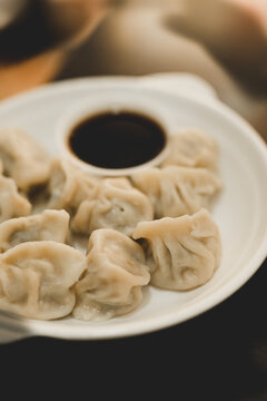 Portion of dumplings with sauce