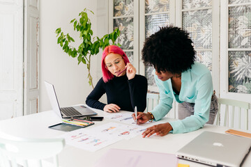 Creative female designers working at home