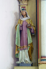 Fototapeta na wymiar St. Lucia, statue on the altar of St. Barbara in the parish church of the Assumption of the Virgin Mary in Pescenica, Croatia
