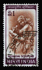 Stamp printed in India shows Woman Writing Letter, Chandella Carving, 11th Century, circa 1966
