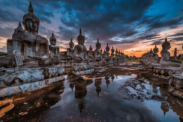 Many Statue buddha image at sunset in southen of Thailand