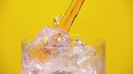 Pouring Drink Ice Cold Beverage Ice Cubes in Transparent  Glass Slow Motion