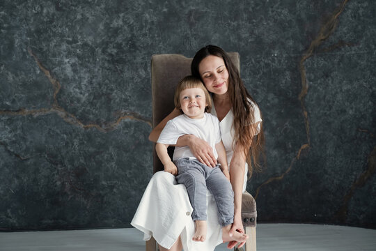 Studio Portrait of young mom and little baby son