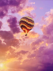 color hot air balloon in blue sky with clouds closeup