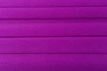 Abstract purple background with horizontal stripes. Trendy textured background made of corrugated paper . Flat lay, copy space. 