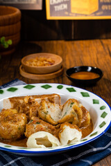 Pempek or empek-empek is a savoury Indonesian fishcake delicacy, made of fish and tapioca, from Palembang South Sumatera, Indonesia. Pempek is served with rich sweet and sour sauce called kuah cuko