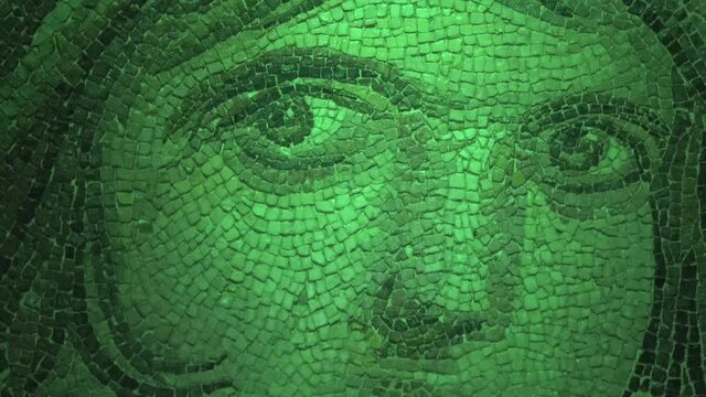 Gaziantep, Turkey - 15th of June 2021: 4K At the Zeugma Mosaic Museum - Eyes of the Gypsy girl mosaic in night vision mode
