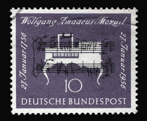Stamp printed in Germany, shows note handwriting of Mozart and clavichord and was brought out on...