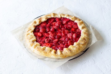 Strawberry galette or open pie . Baking. Vegetarian food.