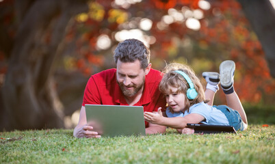 family blog. childhood and parenthood. happy boy listen music in headphones.