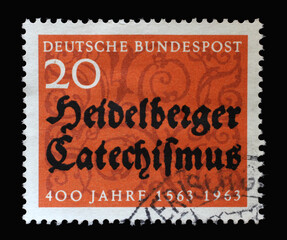 Obraz premium Stamp printed in Germany dedicated to 400 years of the Heidelberg Catechism, containing the doctrine of the reformed church, circa 1963