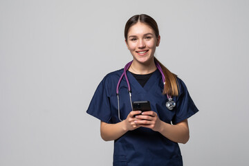 Young woman medical doctor use mobile phone isolated on white background. - obrazy, fototapety, plakaty