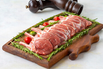 Lamb chops on wooden background