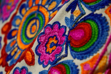 Closeup of colorful embroidered Indian pillowcase