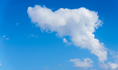 white clouds on a background of blue sky, cloud formations in the sky.