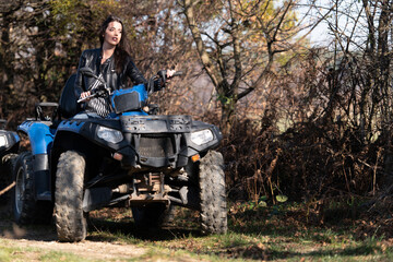Woman Driving Off-road With Quad Bike or Atv