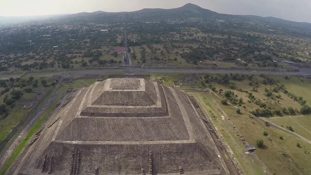the world's third largest pyramid, the pyramid of the Sun in Teotihuacan with ruin walls in the foreground on a rare smog free day (aerial photography)