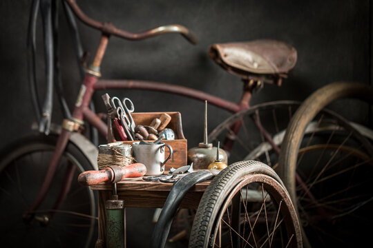 Vintage bicycle repair workshop with spare parts. Vulcanization workshop